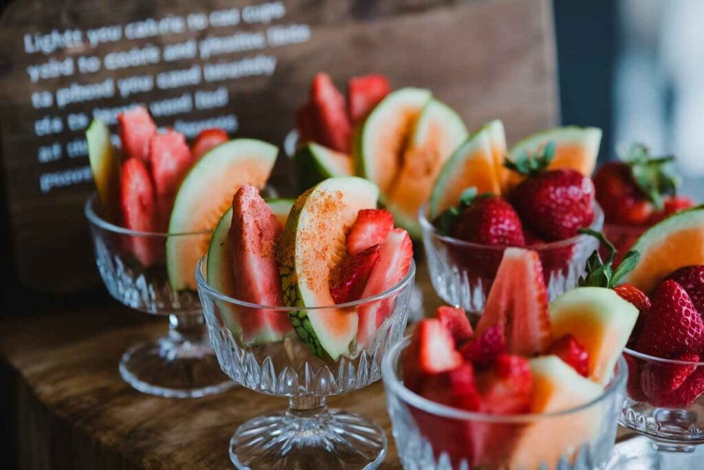 A close-up of fruit cups made with low-sugar fruits, garnished with a sprinkle of cinnamon.